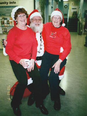 Santa with a lap full of ladies